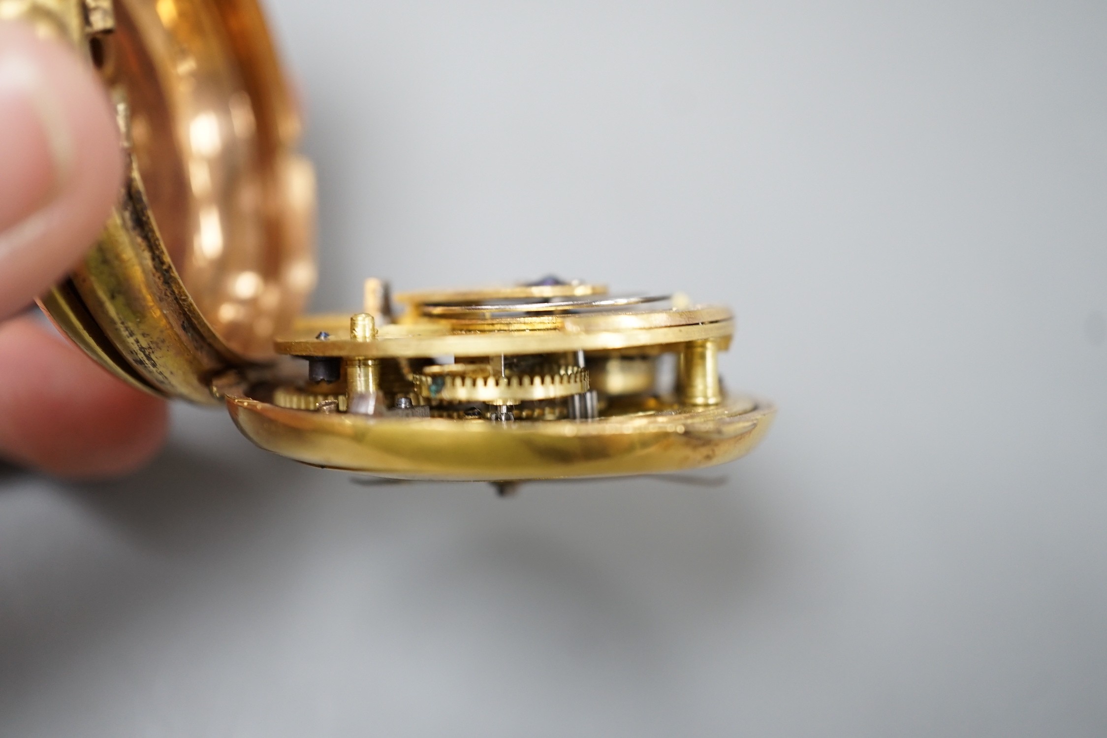 An early 19th century gilt metal verge pocket watch (a.f.).